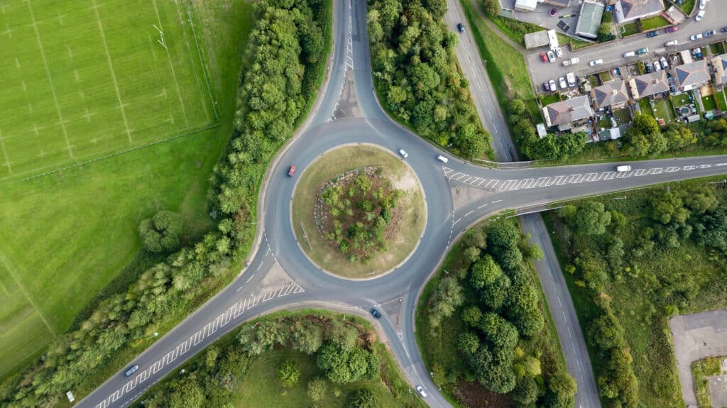 Top,Down,Aerial,View,Of,A,Traffic,Roundabout,On,A